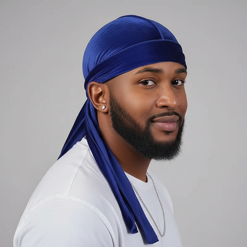 Confident male model wearing a luxe velvet durag, rich color depth, long tails flowing naturally, smooth velvet texture visible, clean studio lighting, premium streetwear aesthetic, soft shadows, modern urban style, close-up head and shoulders, showcasing comfort and fit
